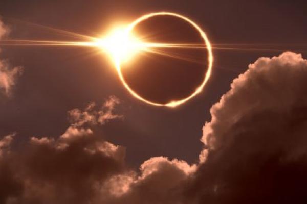 The moon covers the sun in a solar eclipse.