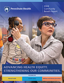 Cover image of the Penn State Health 2024 Community Benefit Report. A woman holds an eye occluder over the right eye of a young girl during an eye exam. The Penn State Health logo is at the top with the title “2024 Community Benefit Report.” At the bottom is the text: “Advancing Health Equity. Strengthening Our Communities. Focusing on mental health, health equity, wellness and disease prevention.”